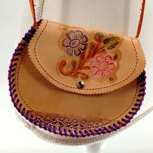 Hand stamped embossed light color leather crossbody lightly painted